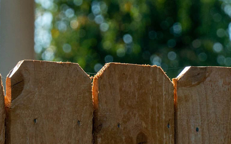 Close up of wood boards on a shadow box fence