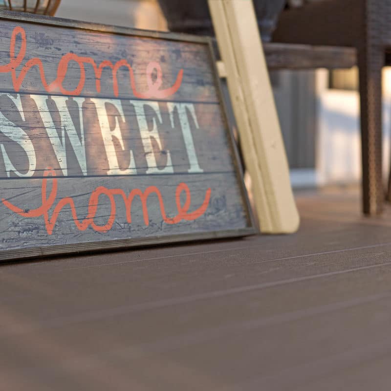 Home sweet home sign on vinyl deck